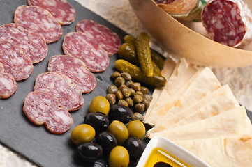 Image showing cold cut platter with pita bread and pickles