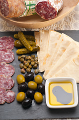 Image showing cold cut platter with pita bread and pickles