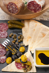 Image showing cold cut platter with pita bread and pickles