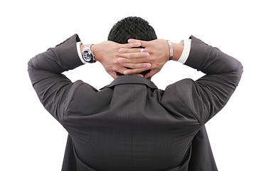 Image showing back of businessman holding hands on head on white background 