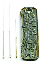 Image showing acupuncture needles on chinese coin