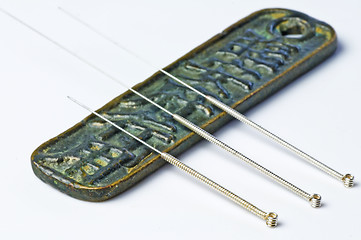 Image showing acupuncture needles on chinese coin