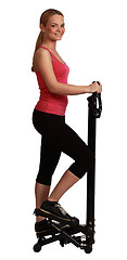 Image showing Blonde Woman Exercising on a Stepper