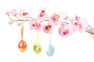 Image showing hanged bright color easter eggs with bows on spring flower