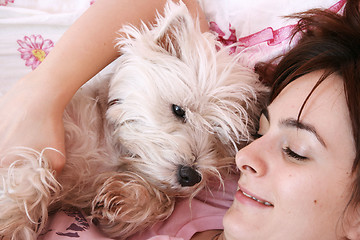 Image showing Dog sleeping on bed 