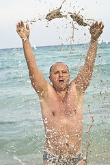 Image showing Portrait of man with spashes in the sea