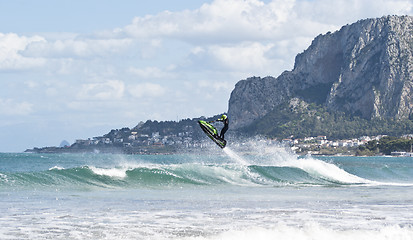 Image showing Man jumps on the jet ski