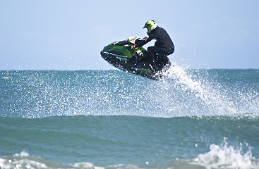 Image showing Man jumps on the jet ski