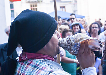 Image showing Portuguese folk group. Men plays a shall