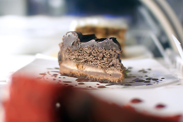 Image showing chocolate cheese cake slice on display