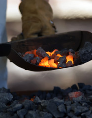 Image showing iron smith working near hot coal
