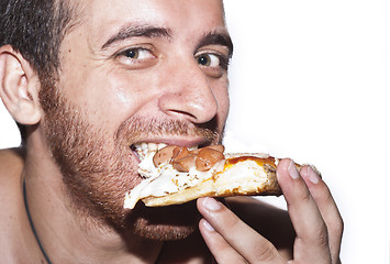 Image showing A man eating Pizza