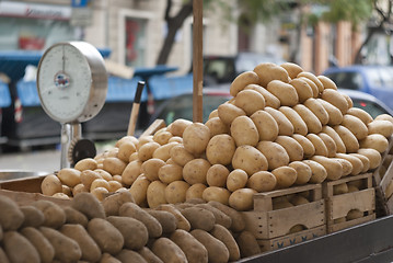 Image showing pile of new and old potatoes for sale