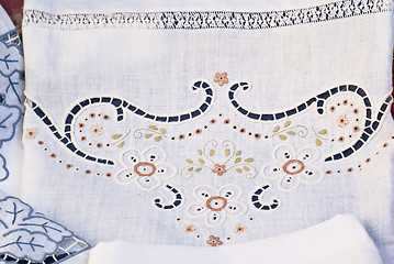 Image showing carved and embroidered cloth. handmade