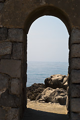 Image showing old arch with sea and rocks in Cefalu