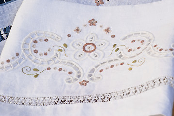 Image showing carved and embroidered cloth. handmade