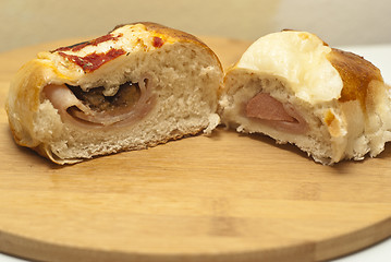 Image showing Sicilian rotisserie. pieces of rotisserie on wooden board