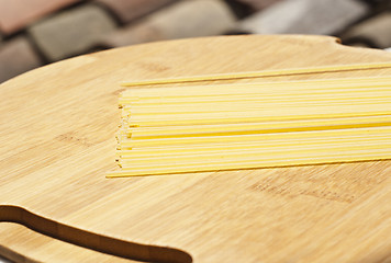 Image showing spaghetti on wooden board