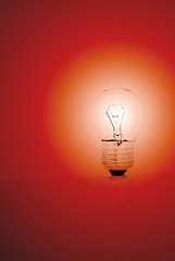 Image showing light bulb on a red background