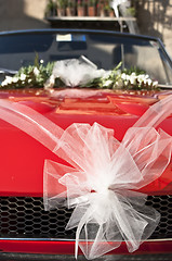 Image showing red wedding car