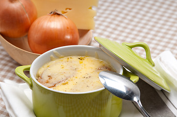 Image showing onion soup with melted cheese and bread on top