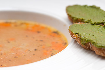 Image showing Italian minestrone soup with pesto crostini on side