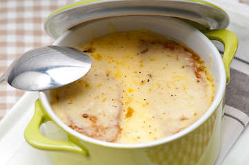 Image showing onion soup with melted cheese and bread on top