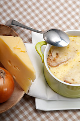 Image showing onion soup with melted cheese and bread on top