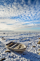 Image showing Fishing boat on the sea shore sunny winter afternoon