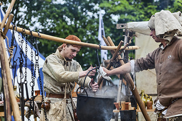 Image showing Medieval Men Preparing Food