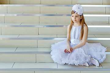 Image showing Girl sitting on the steps