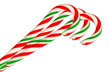 Image showing Three sugar sticks in white green and red isolated on white back