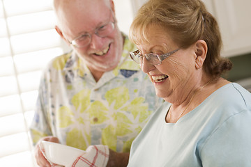 Image showing Senior Adult Couple Washing Dishes Together Inside Kitchen