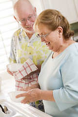 Image showing Senior Adult Couple Washing Dishes Together Inside Kitchen