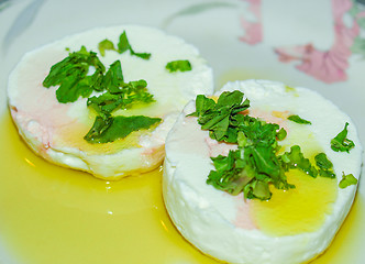 Image showing Tomino cheese with rucola and olive oil