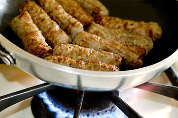 Image showing cooking sausages in a pan