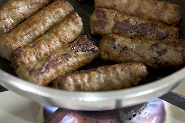 Image showing cooking sausages in a pan