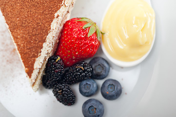 Image showing tiramisu dessert with berries and cream