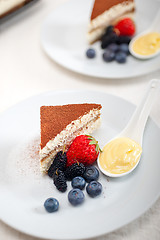 Image showing tiramisu dessert with berries and cream