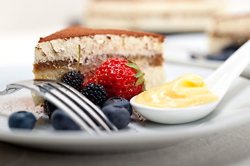 Image showing tiramisu dessert with berries and cream