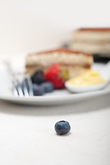 Image showing tiramisu dessert with berries and cream