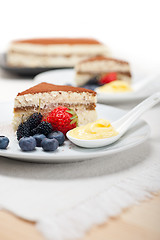 Image showing tiramisu dessert with berries and cream