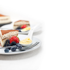 Image showing tiramisu dessert with berries and cream