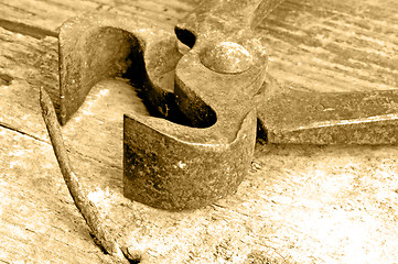 Image showing old rusty pliers with nail