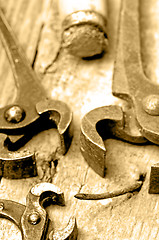 Image showing old rusty pliers with nail