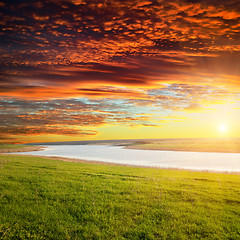 Image showing red sunset over river