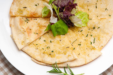 Image showing garlic pita bread pizza with salad on top