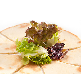 Image showing garlic pita bread pizza with salad on top