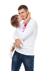 Image showing Studio portrait of loving young father hugging his child