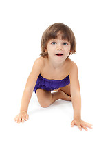 Image showing Little girl crawling on the floor